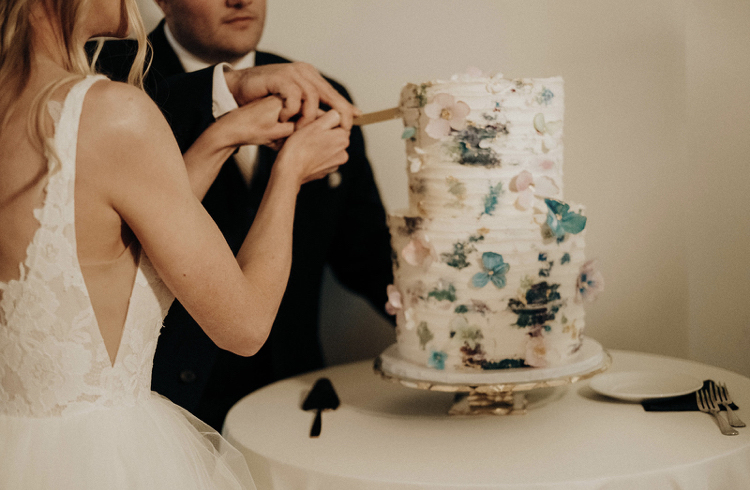 Two tiered cake with abstract floral art, hand painted and hand made wafer floral