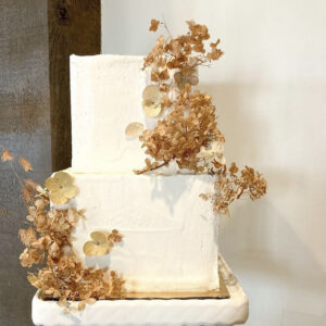Two tiered cake with dried floral starts at 250