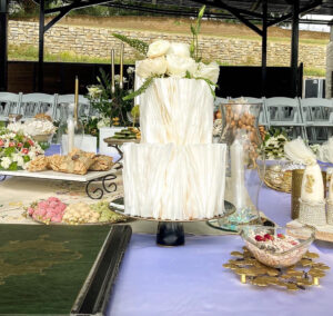 Two tiered cake with wafer paper design and fresh floral