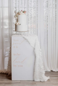 Two tiered wedding cake with fresh floral